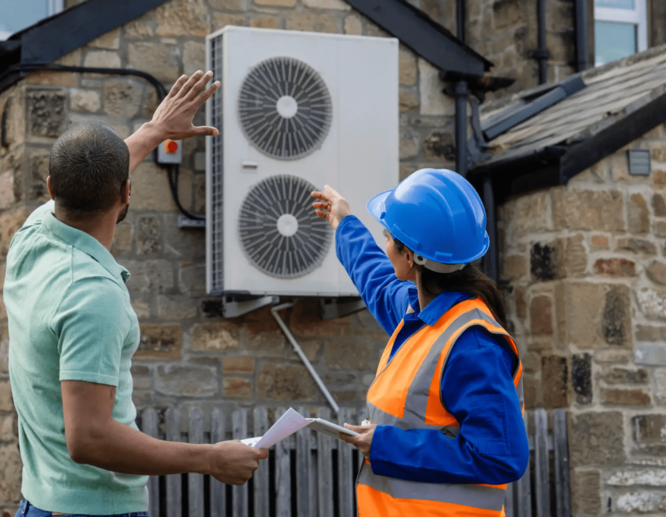 Technician explaining air conditioning unit