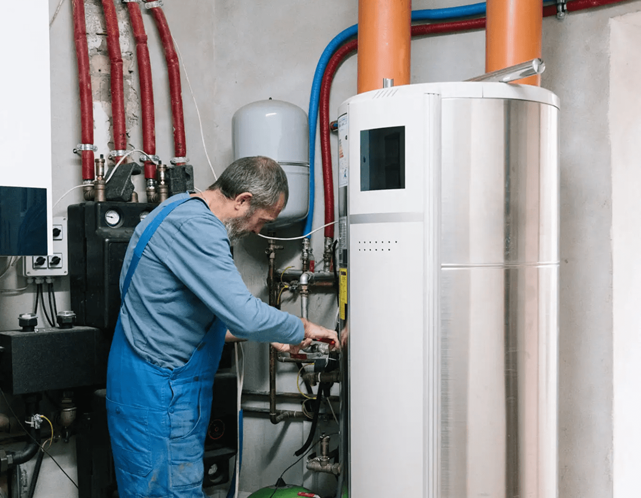 Man fixing boiler unit