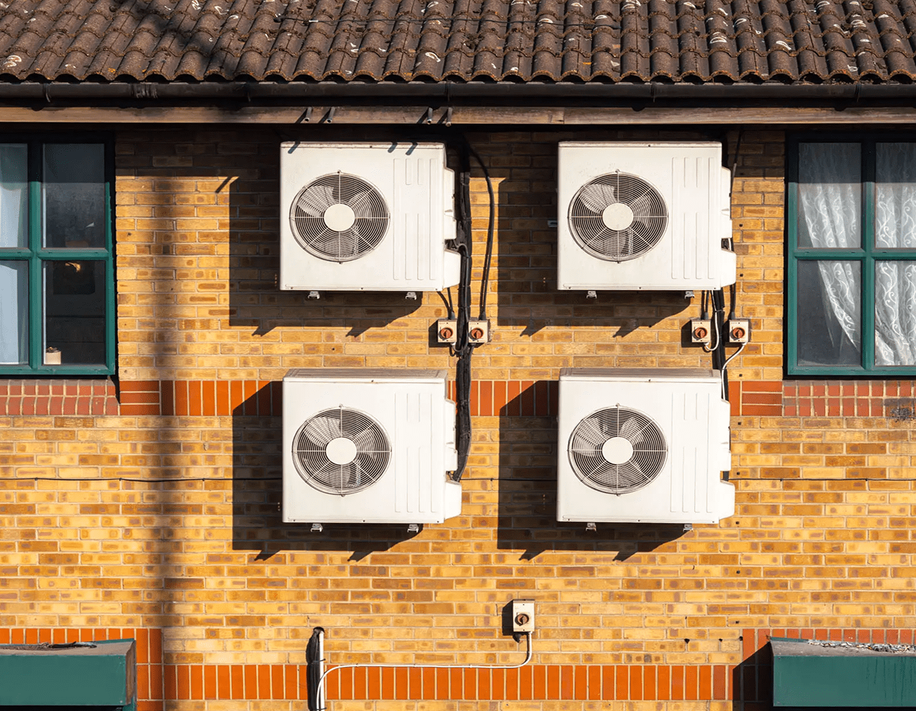 Four AC units mounted outside