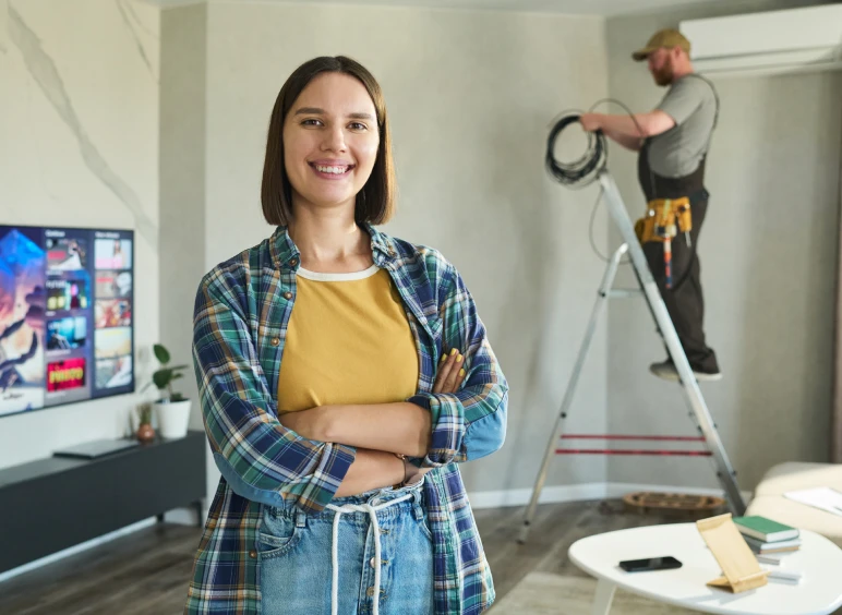 Woman standing confidently in living room